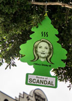 Hillary reeks of scandal