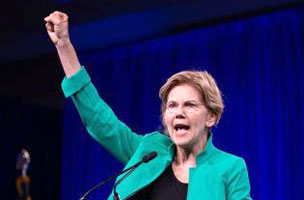 Warren raises her fist in a Communist salute.